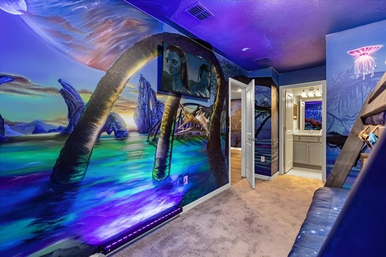 Immersive fantasy-themed room with glowing wall art, bunk beds, and vibrant colors.