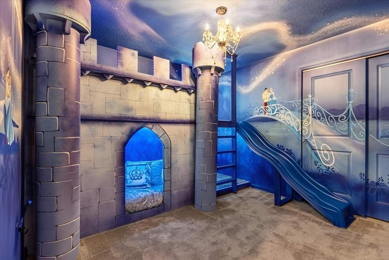 Magical princess castle room with bunk beds, a slide, and dreamy fairytale decor.