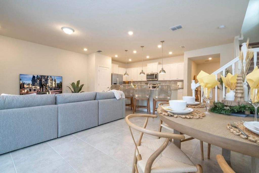 Modern living space with a stylish kitchen and cozy dining area for relaxation.