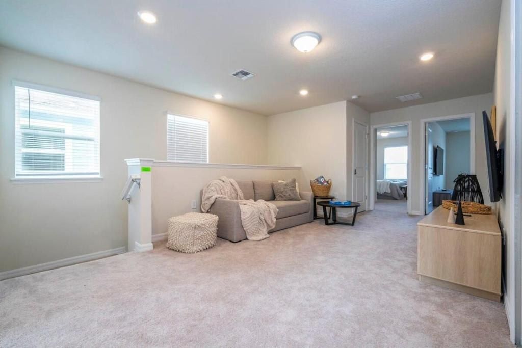 Bright and airy lounge area with cozy seating and a peaceful, minimalist design.