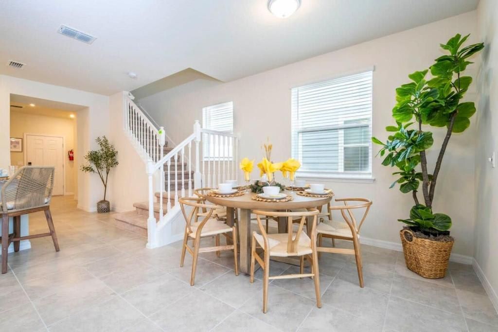 Bright dining area with a fresh, natural feel and modern, stylish seating.