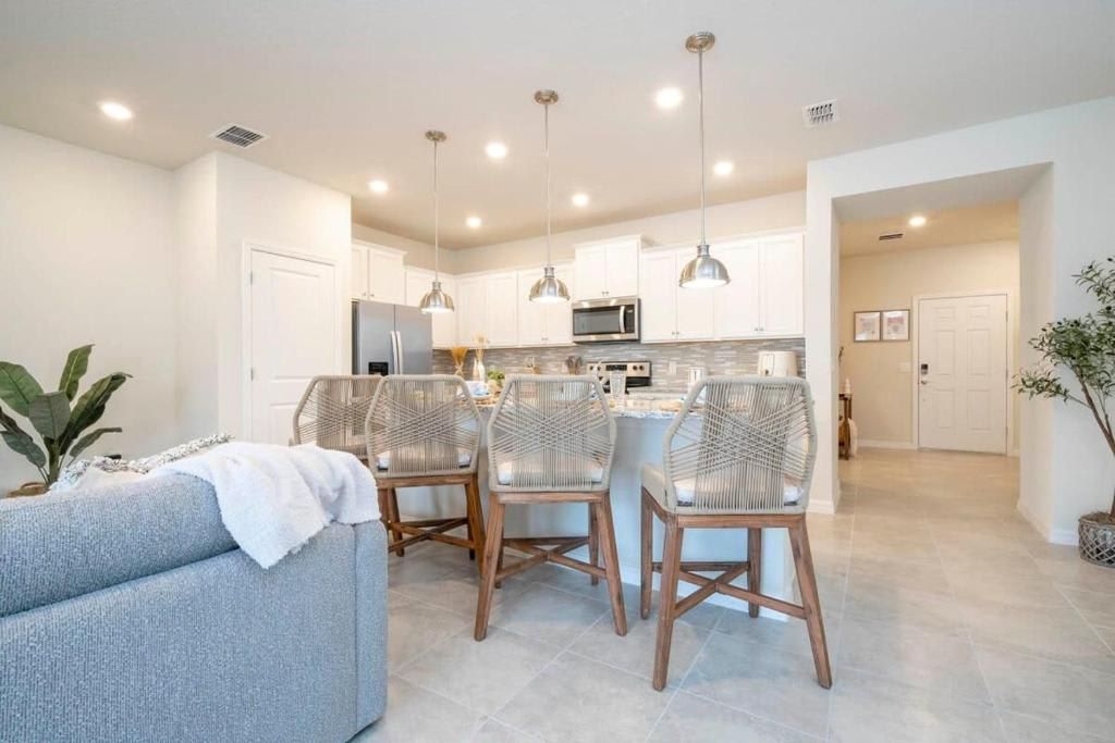 Bright and modern open-concept living space with stylish kitchen and dining area.