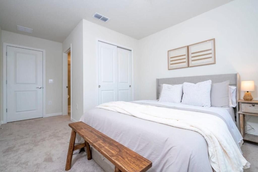 Comfortable bedroom with a spacious bed, natural accents, and clean design.