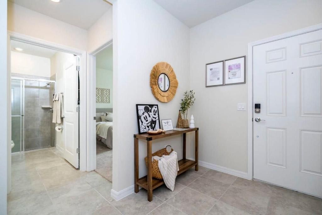 Bright and welcoming entryway with stylish decor and easy access to bedrooms.