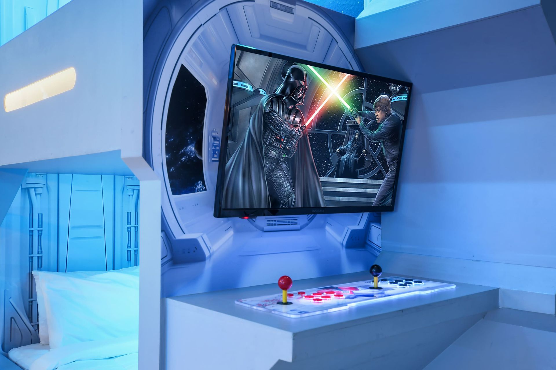 Space-themed bunk room with built-in arcade, glowing lights, and epic wall screen.