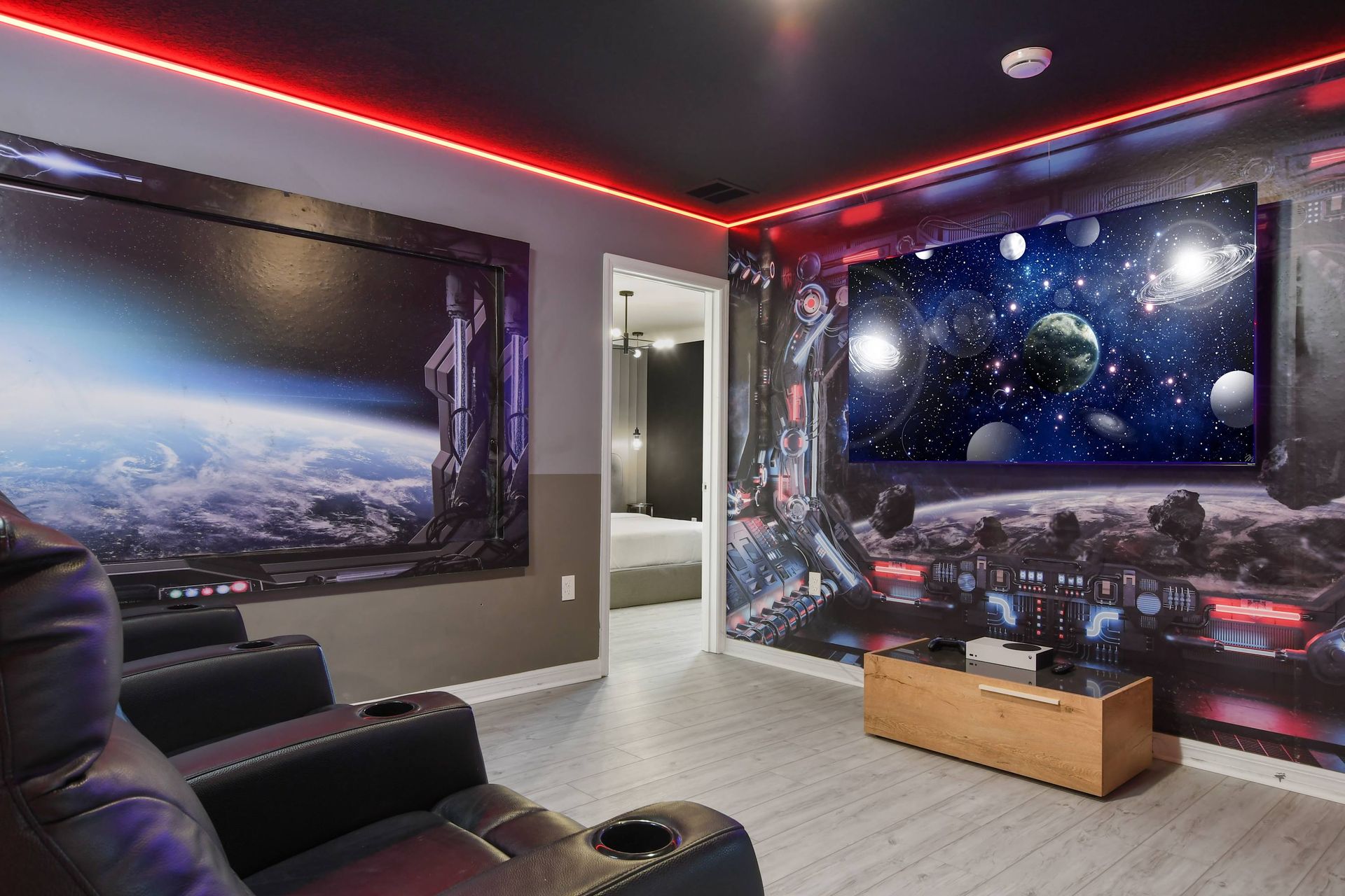 Space-themed theater with LED lights, surround sound, and ultra-comfy recliner seats.