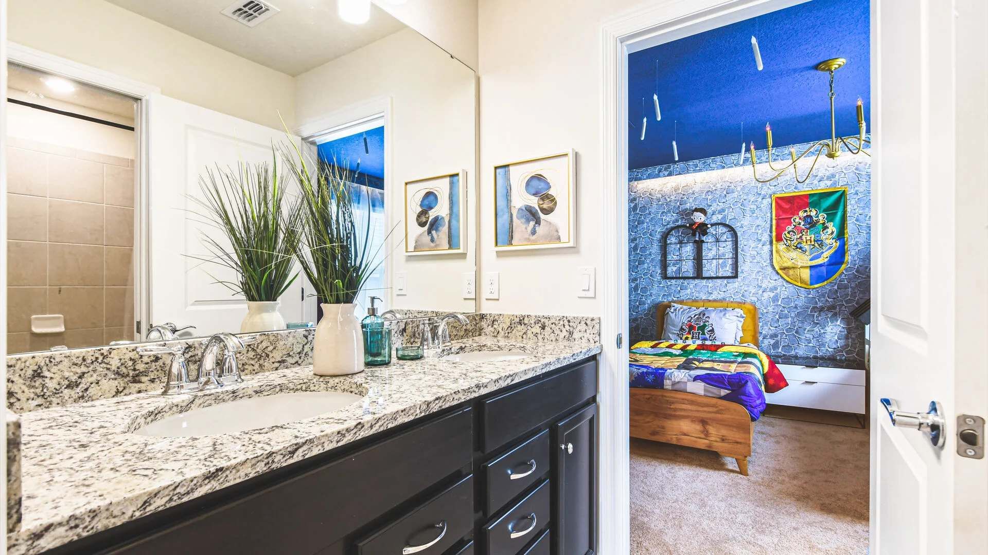 Charming bathroom with granite vanity, walk-in shower, and direct access to themed room.