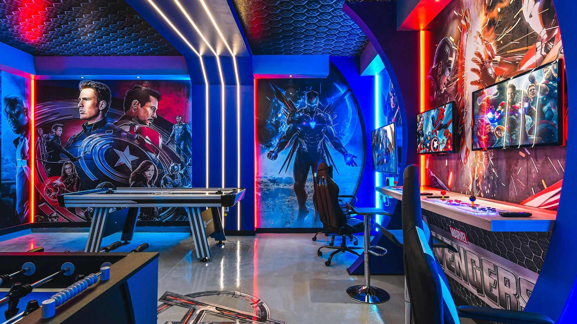 Action-packed game room with hero-themed walls, arcade setup, and LED lighting.