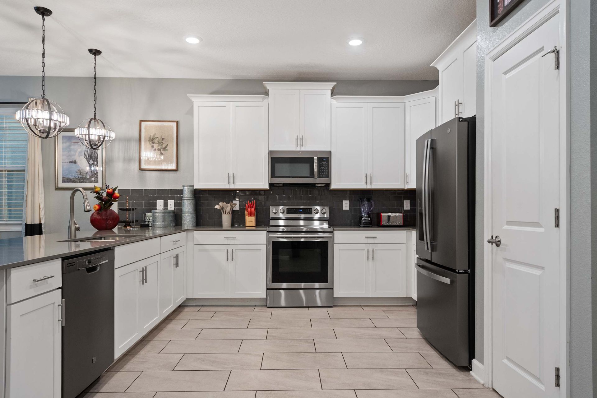 Cook in style in this modern kitchen with stainless steel appliances and sleek design!