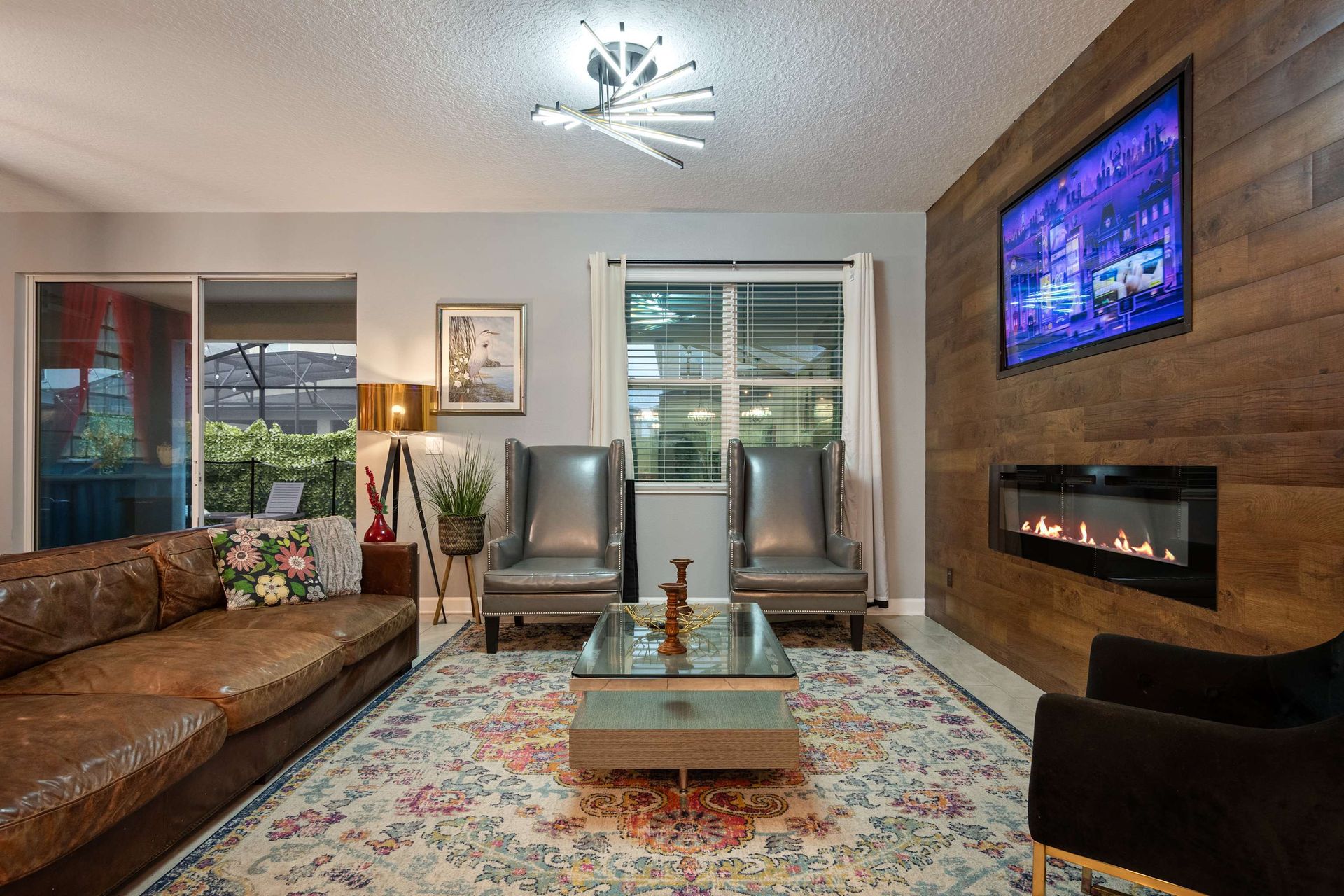 Cozy up in style with modern flair, a fireplace, and vibrant, welcoming decor!
