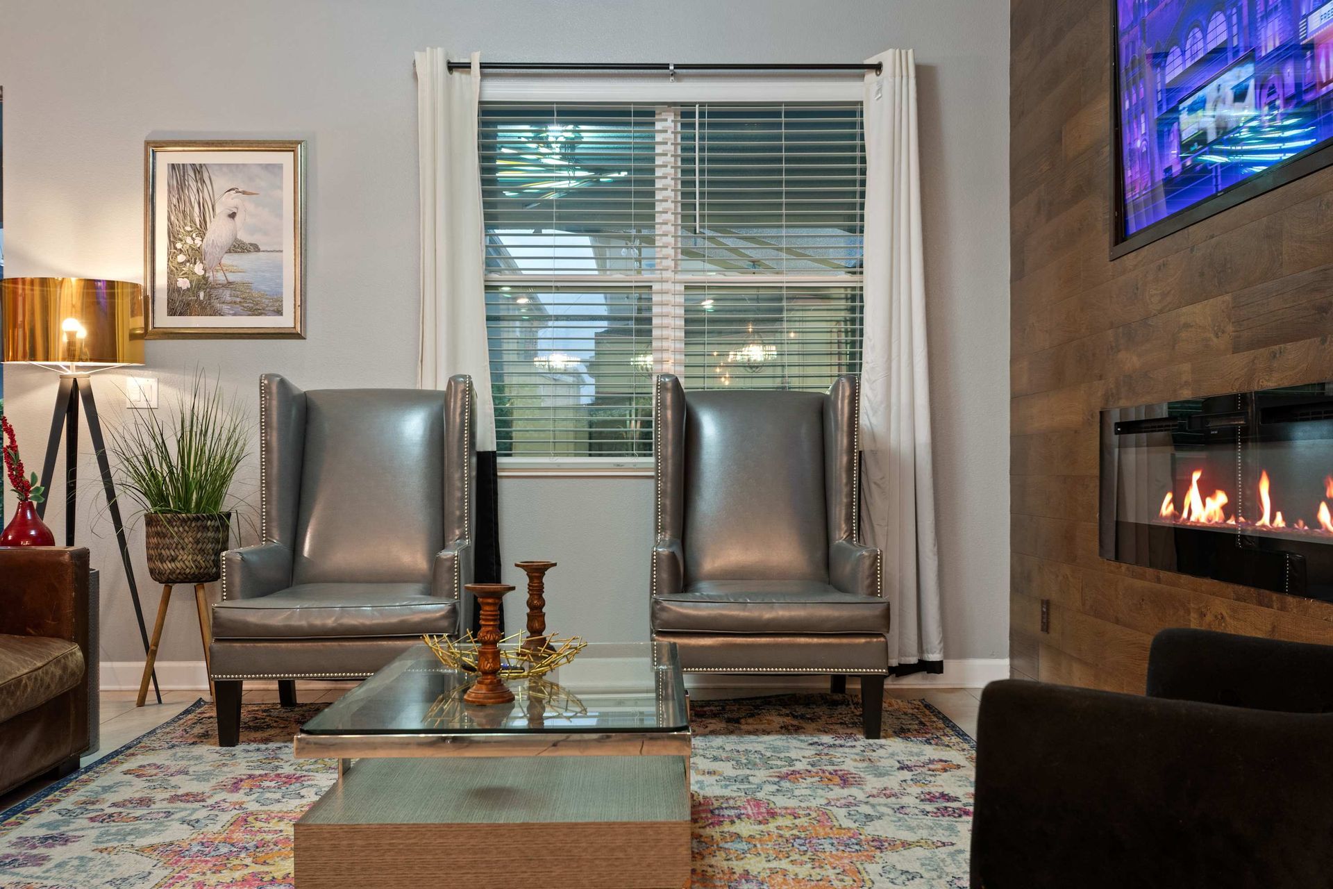 Elegant seating by the fire—unwind in this cozy, stylish living room retreat!