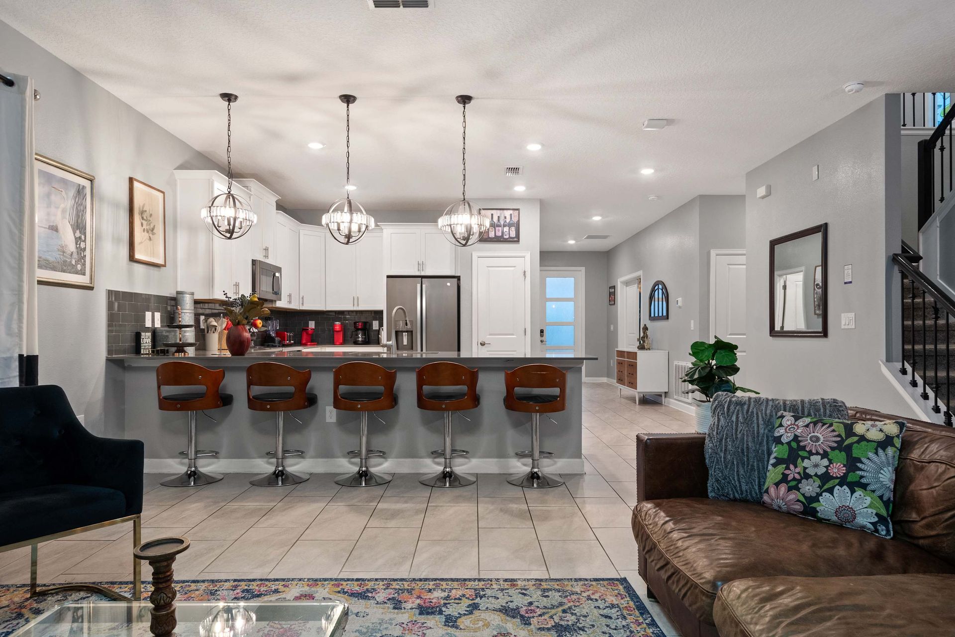Gather around the stylish kitchen island in this spacious, modern open-concept home!