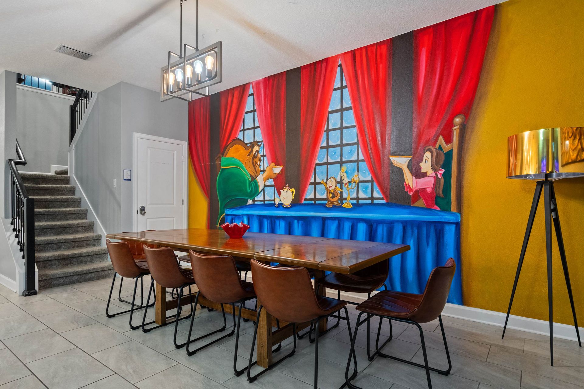 Charming dining space with a Beauty and the Beast mural for magical mealtimes!