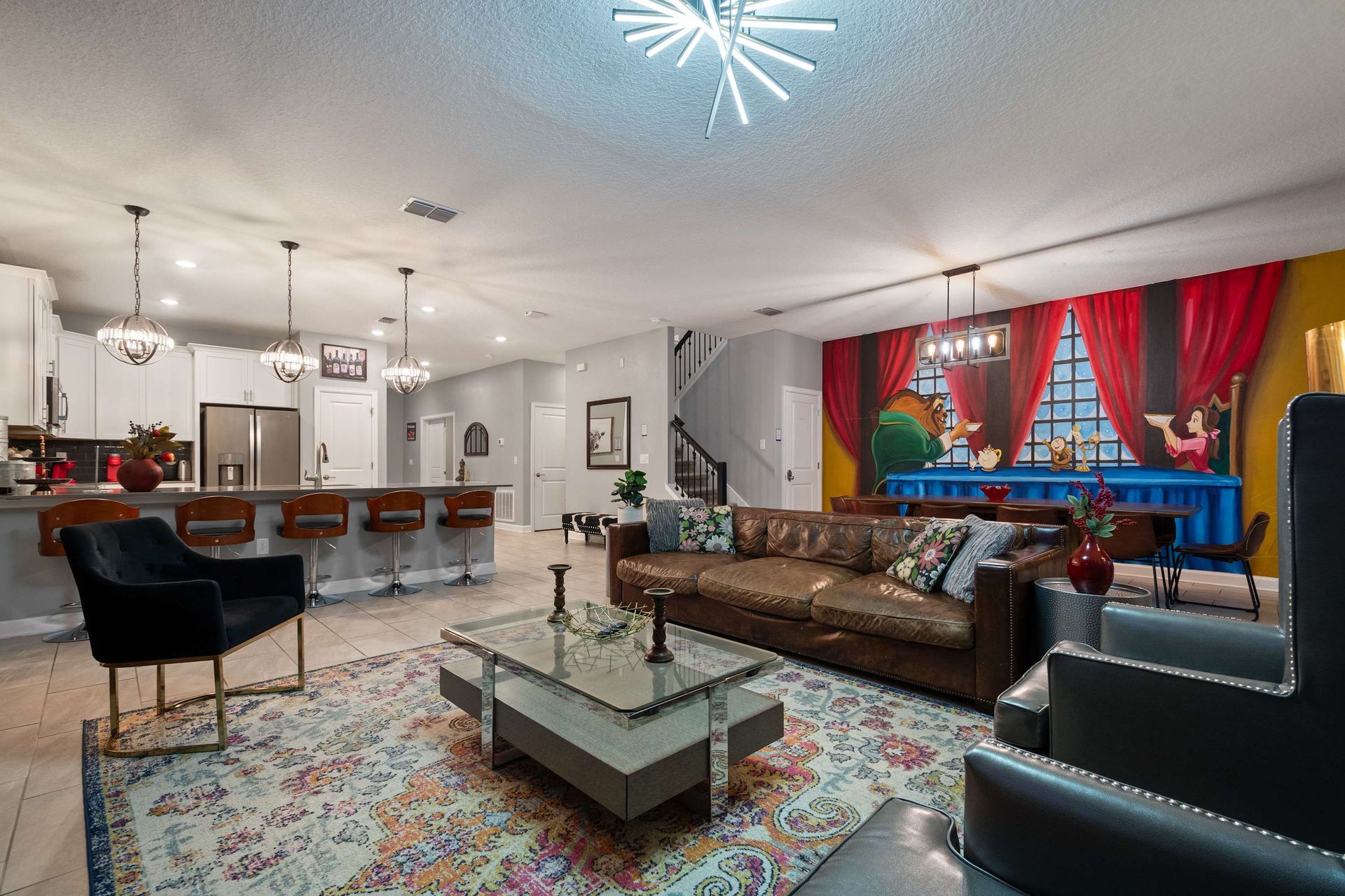 Entertain in style with this open-concept space featuring Disney flair and luxe vibes!