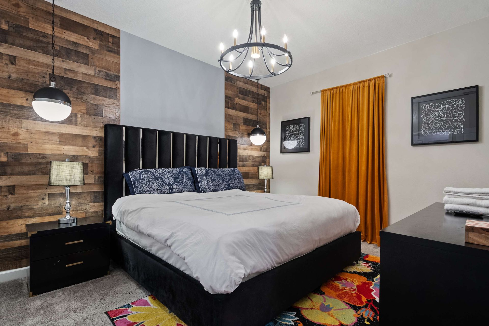 Rustic charm meets modern flair in this cozy bedroom with wood accents and bold style!
