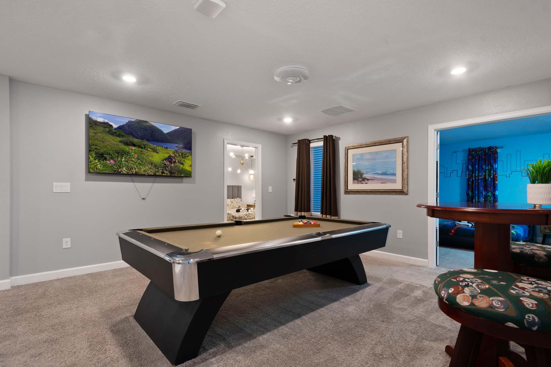 Game night ready! Enjoy friendly competition in this stylish upstairs billiards room.
