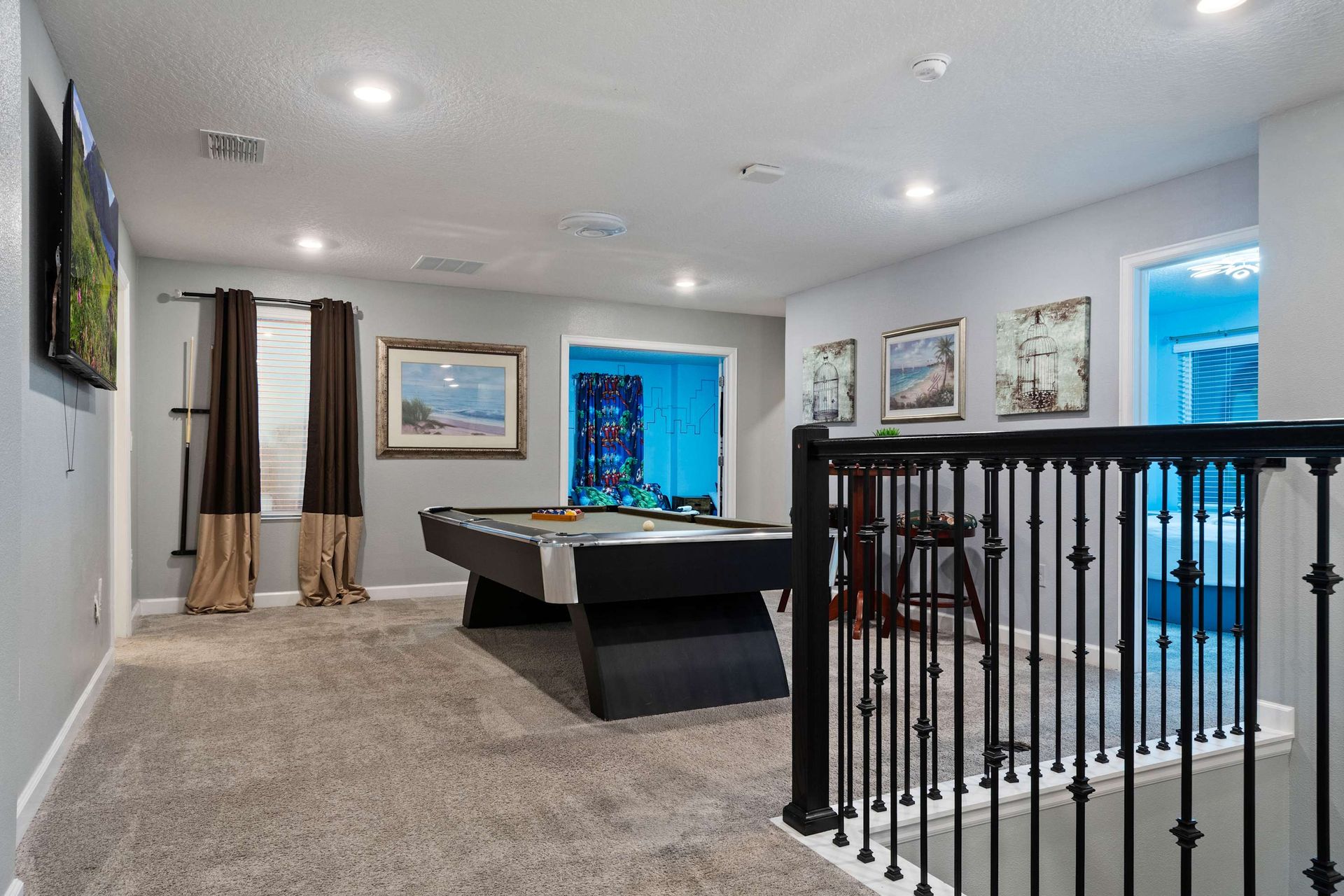 Upstairs game loft with pool table and lounge vibe—ideal for laid-back fun!
