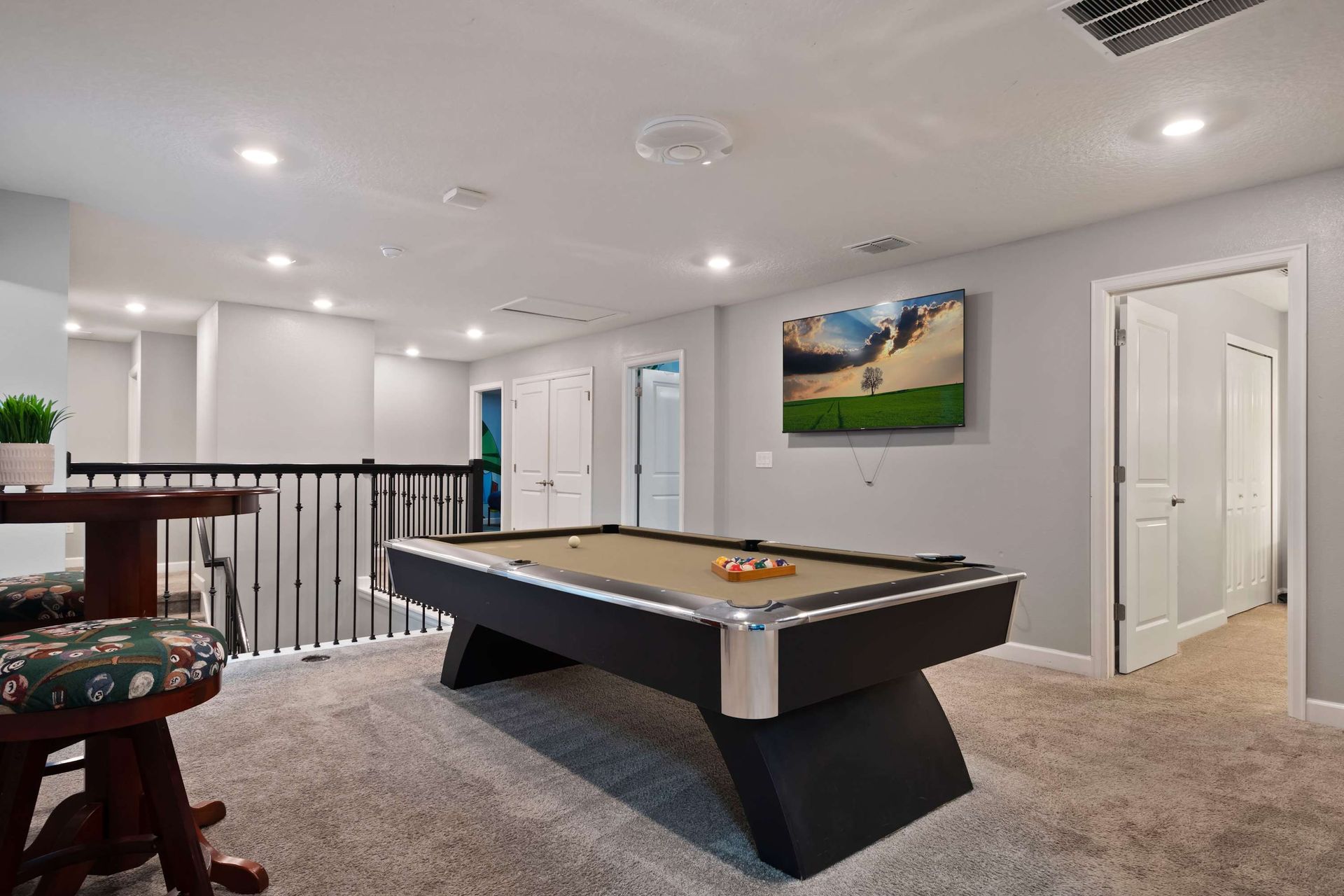 Spacious upstairs game loft with pool table—perfect for relaxing and friendly fun!