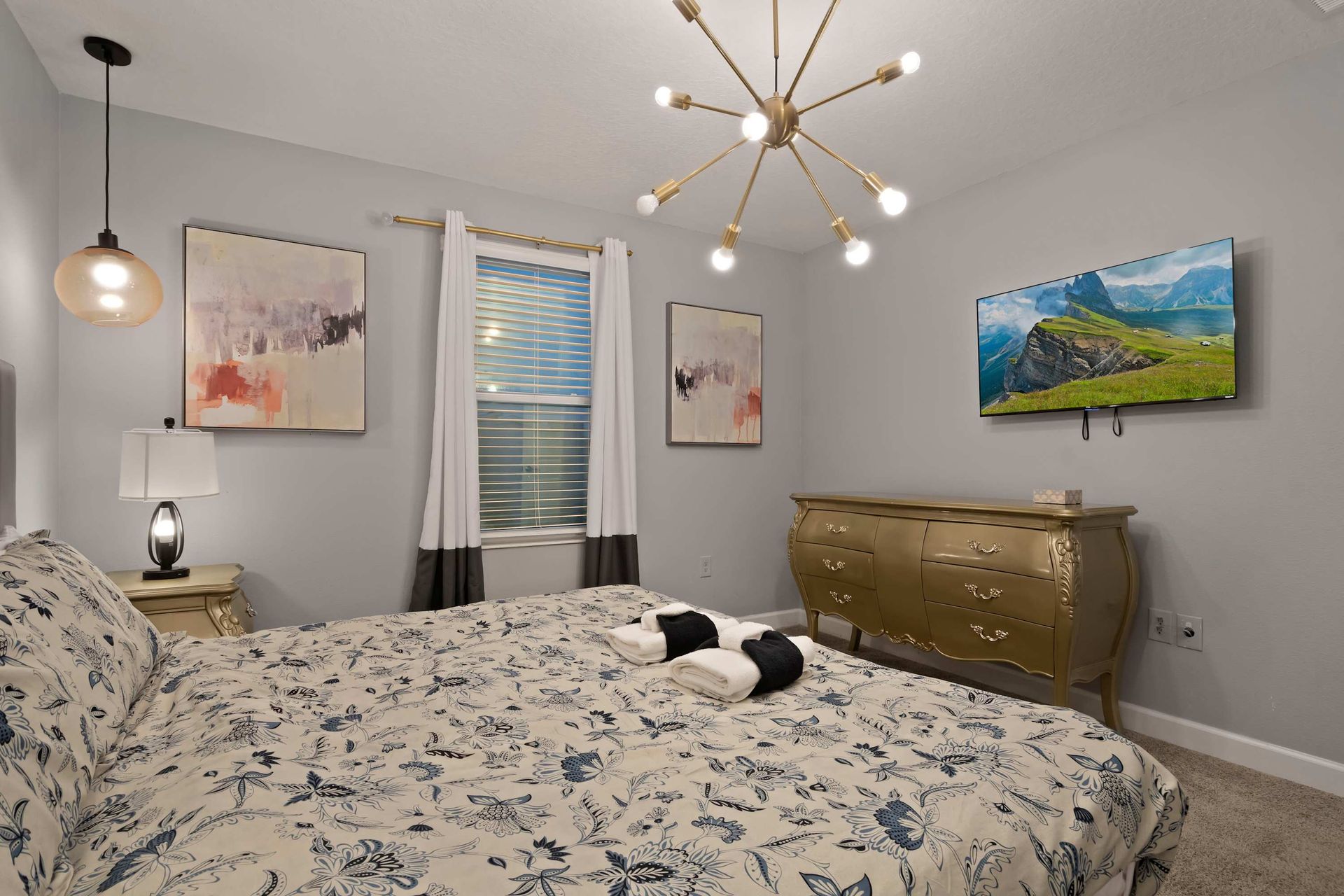 Tranquil and stylish bedroom with elegant decor, cozy bedding, and modern lighting!