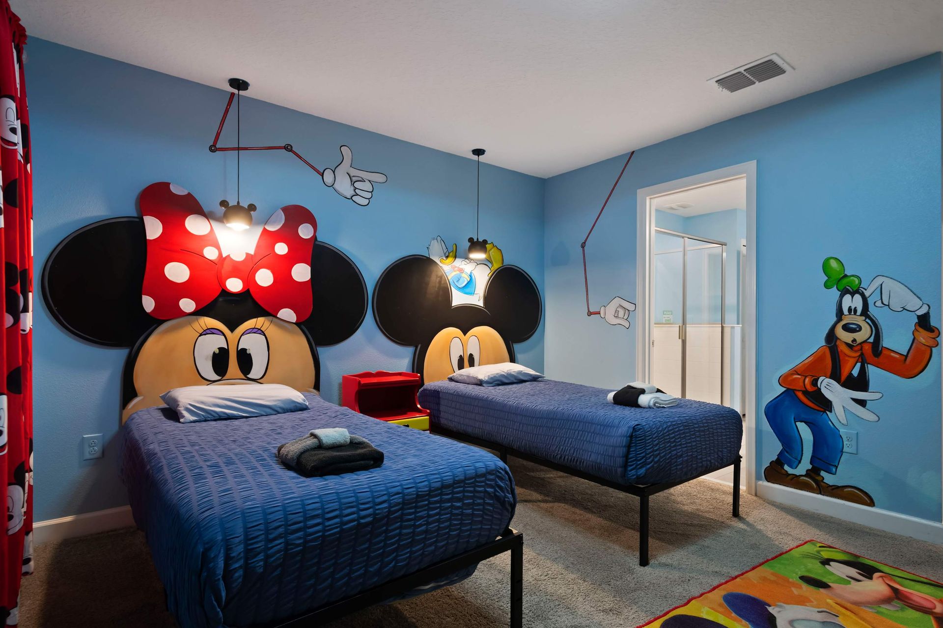 Whimsical Mickey & Minnie bedroom with playful murals and a touch of Goofy fun!