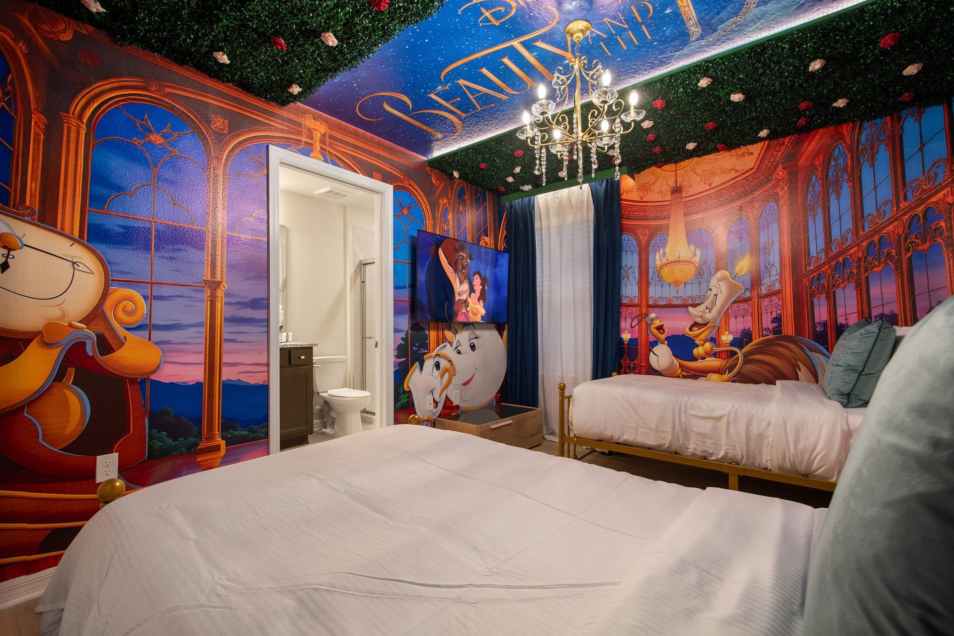 Whimsical Beauty and the Beast room with vibrant murals and fairytale charm.