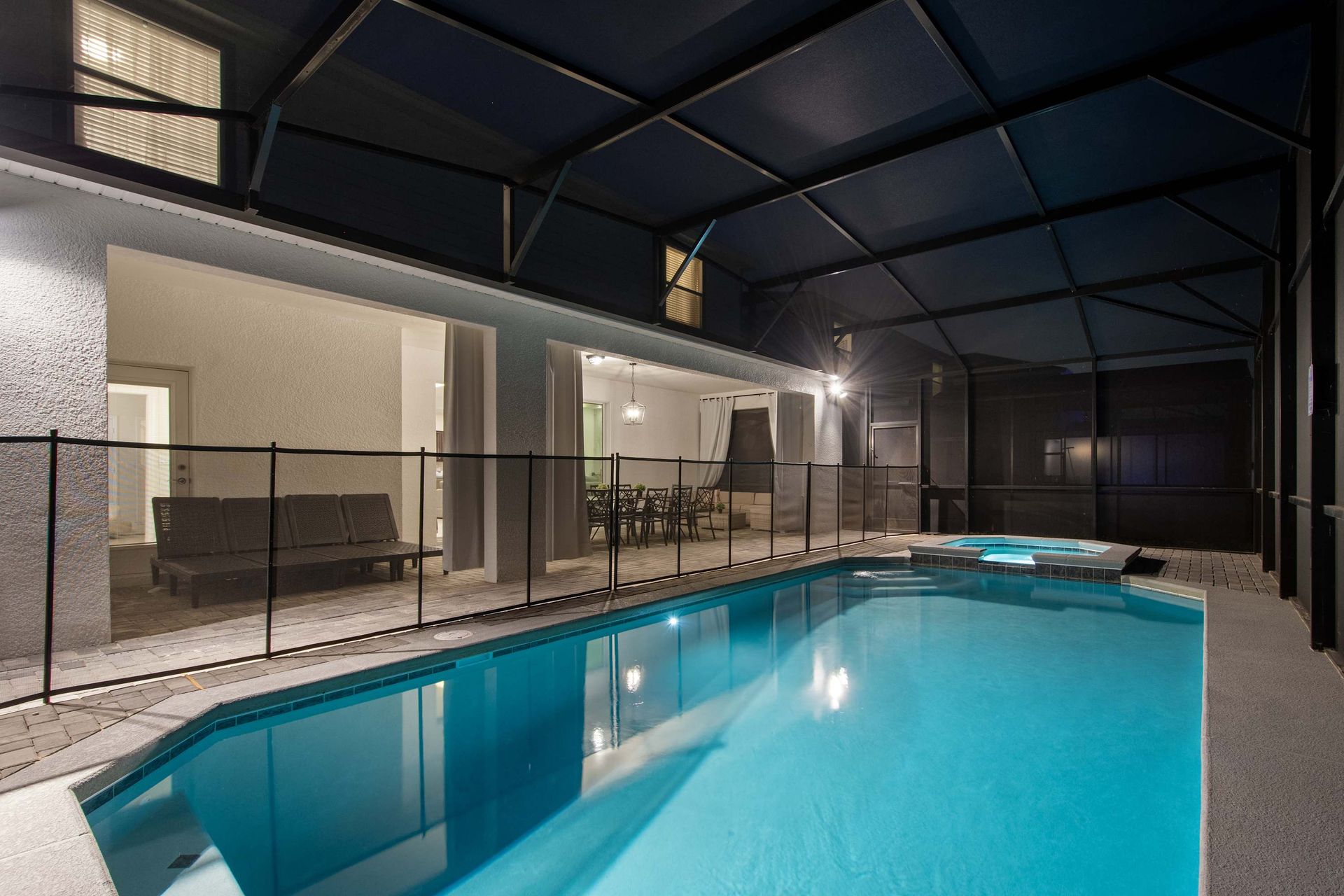 Spacious screened pool area with lounge seating for relaxing day or night.