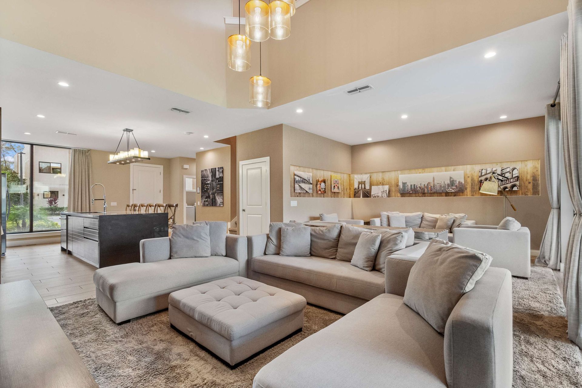 Expansive lounge with plush seating, warm lighting, and seamless indoor-outdoor flow
