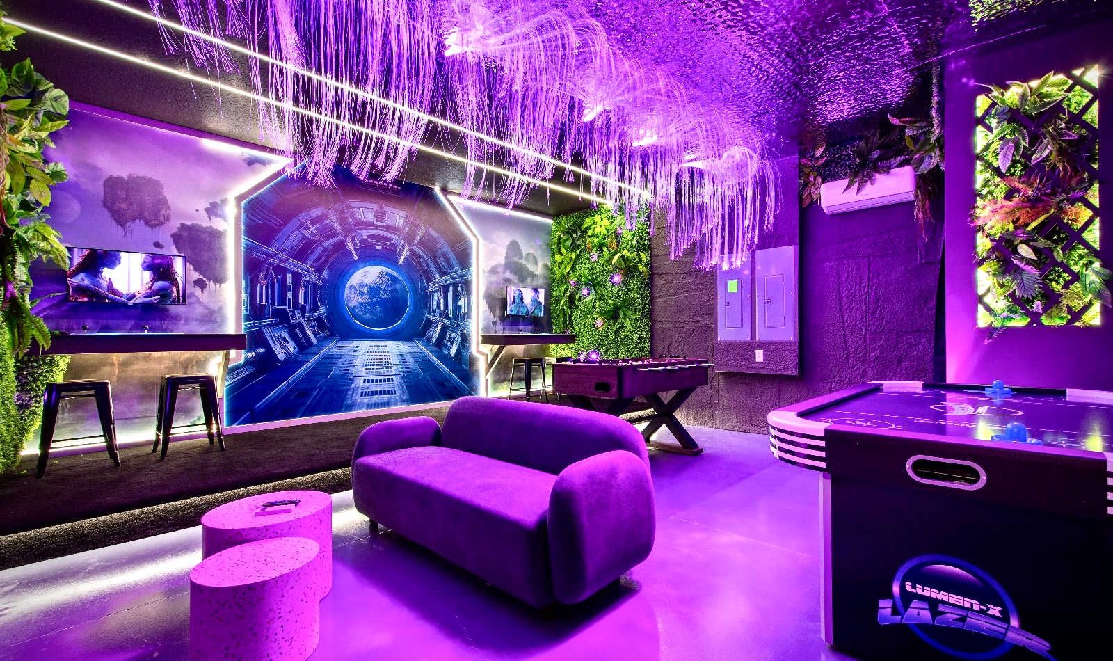 Step into an epic space-themed game room with foosball, air hockey, and more fun.