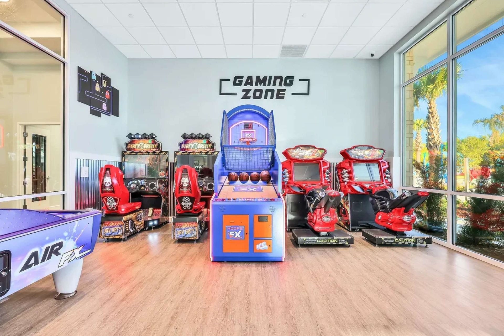 Fun-filled arcade gaming zone with air hockey, basketball, and video games for all
