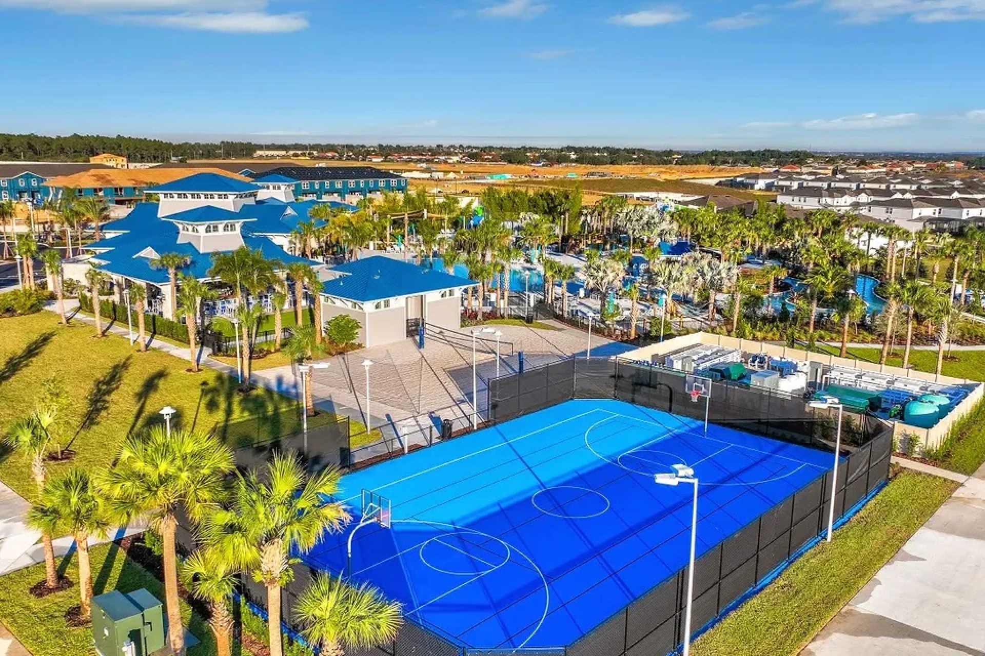 Sunny blue tennis and basketball courts for fun outdoor games and family activities
