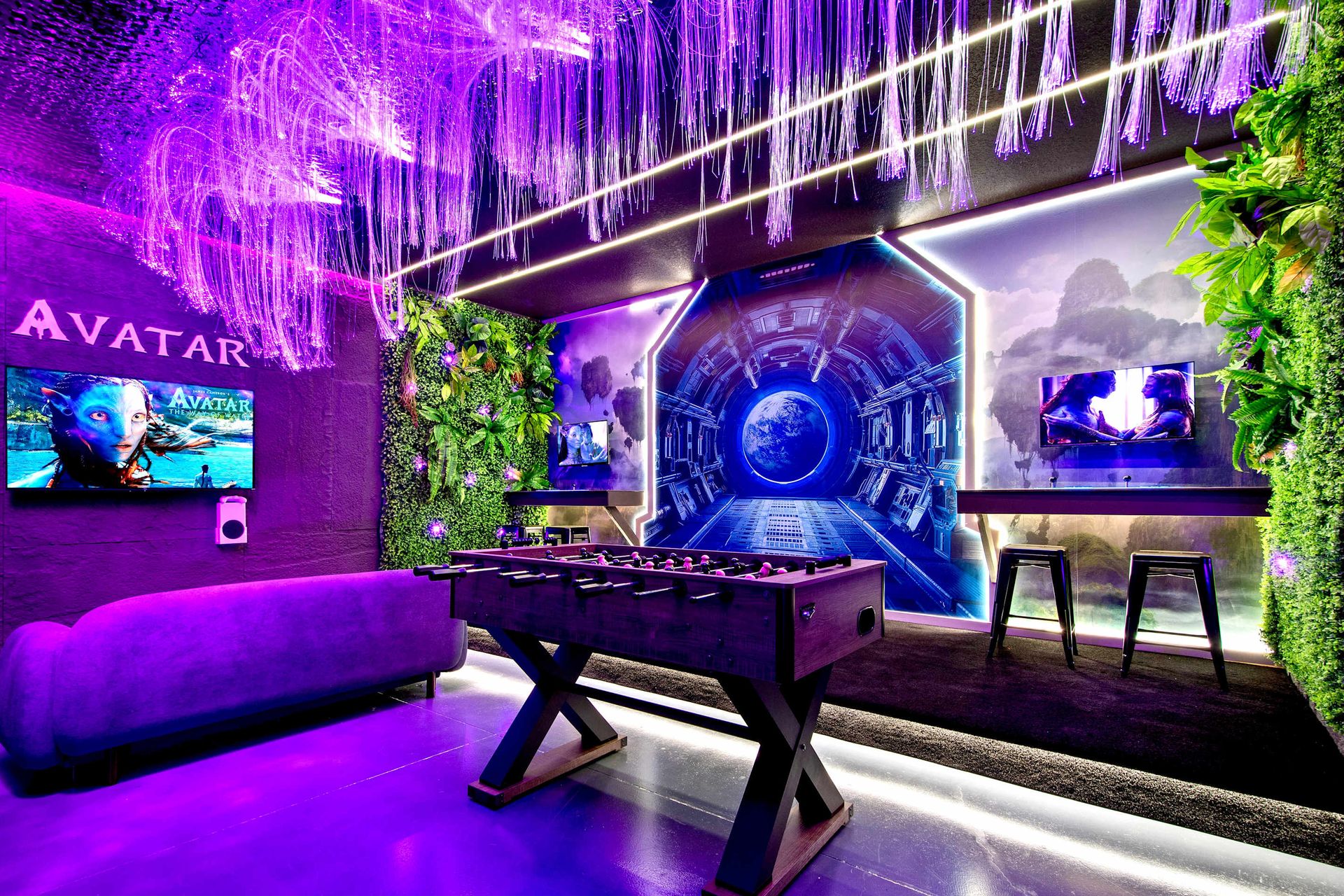 Immersive Avatar-inspired game room with foosball, arcade, and glowing vibes.