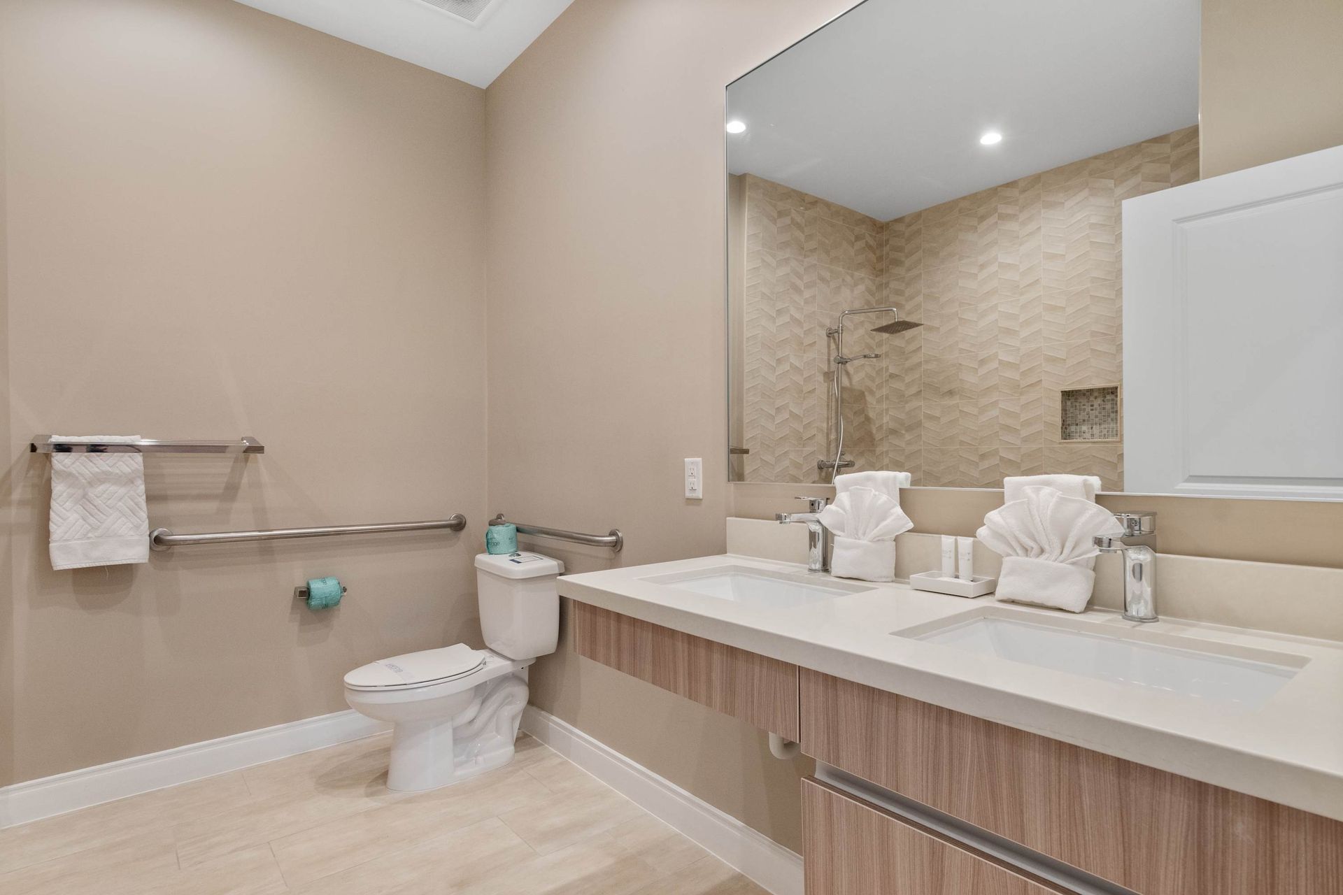 Spacious modern bathroom with double vanity, walk-in shower, and accessible features
