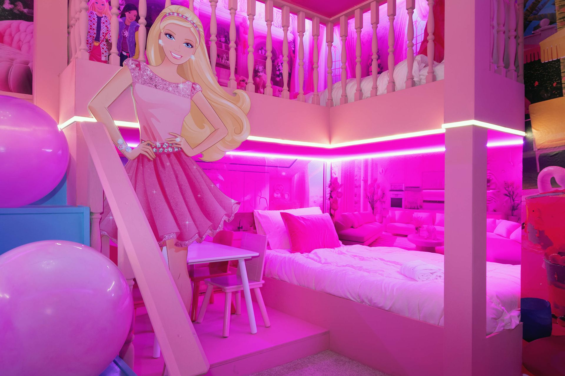Barbie-themed pink paradise with bunk beds, play area, and glowing LED lights.
