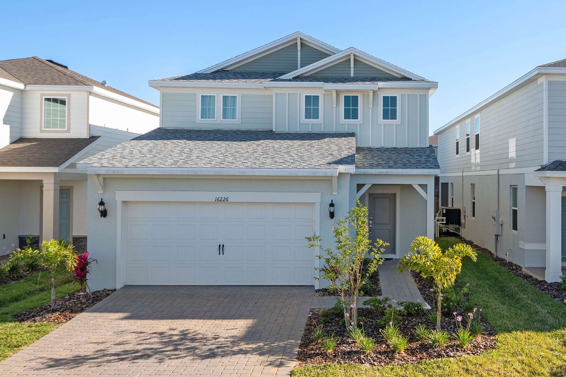 Modern 2-story vacation home with private pool, garage, and beautifully landscaped yard.

