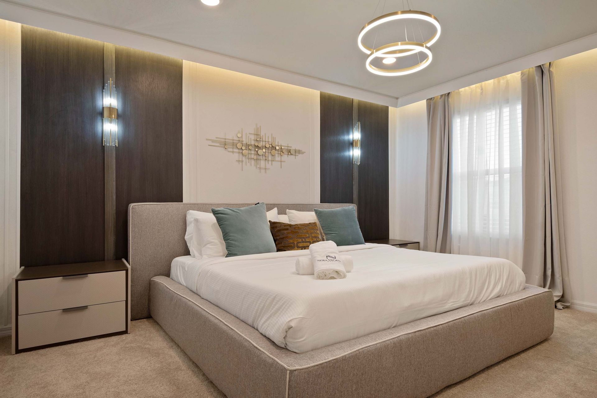 Sleek and serene king bedroom with plush bedding, soft lighting, and modern style.
