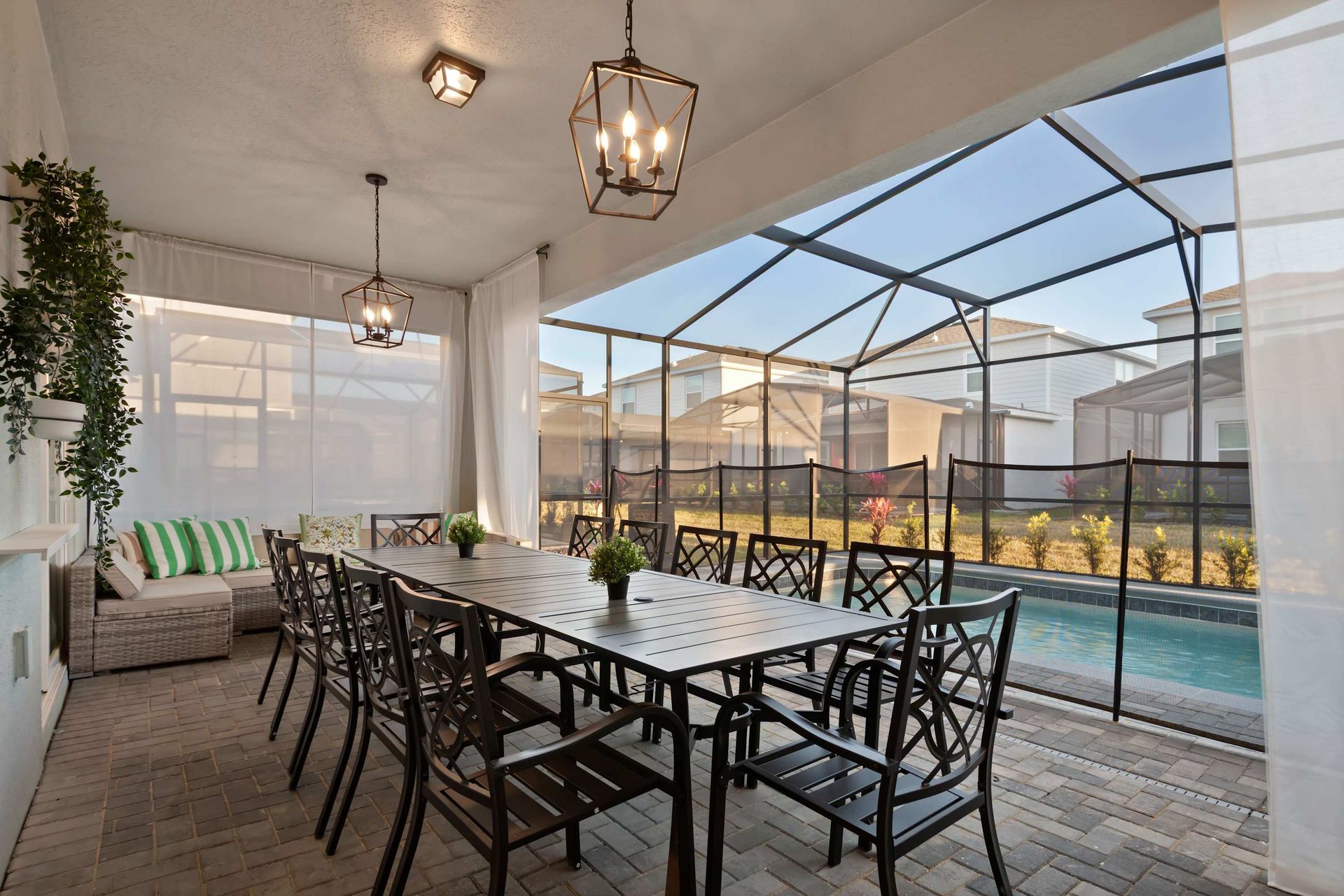 Spacious screened patio with dining for 12, lounge seating, and private pool view.
