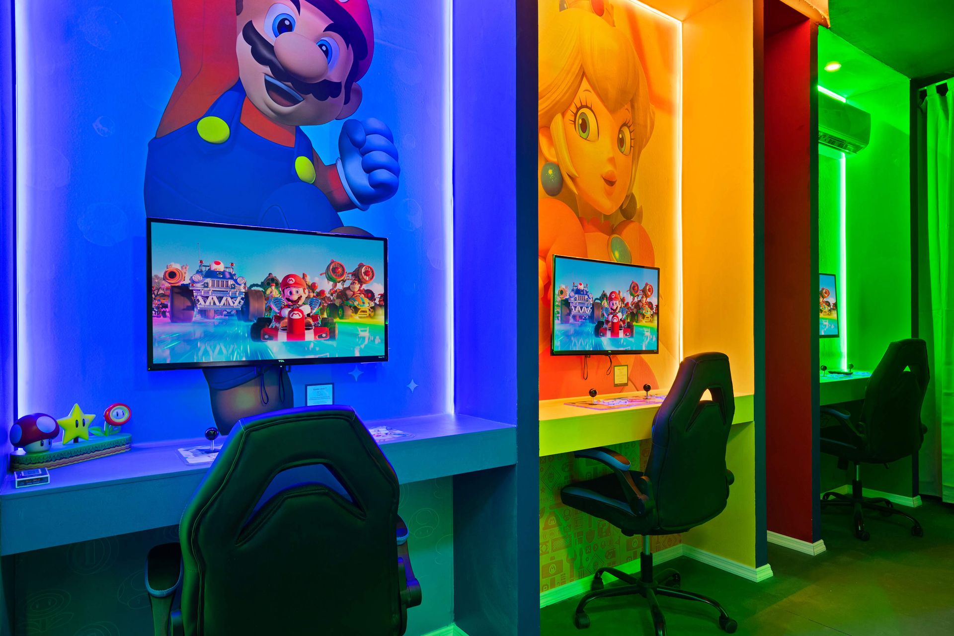 Super Mario gaming stations with LED backlit art, comfy chairs, and fast PCs.
