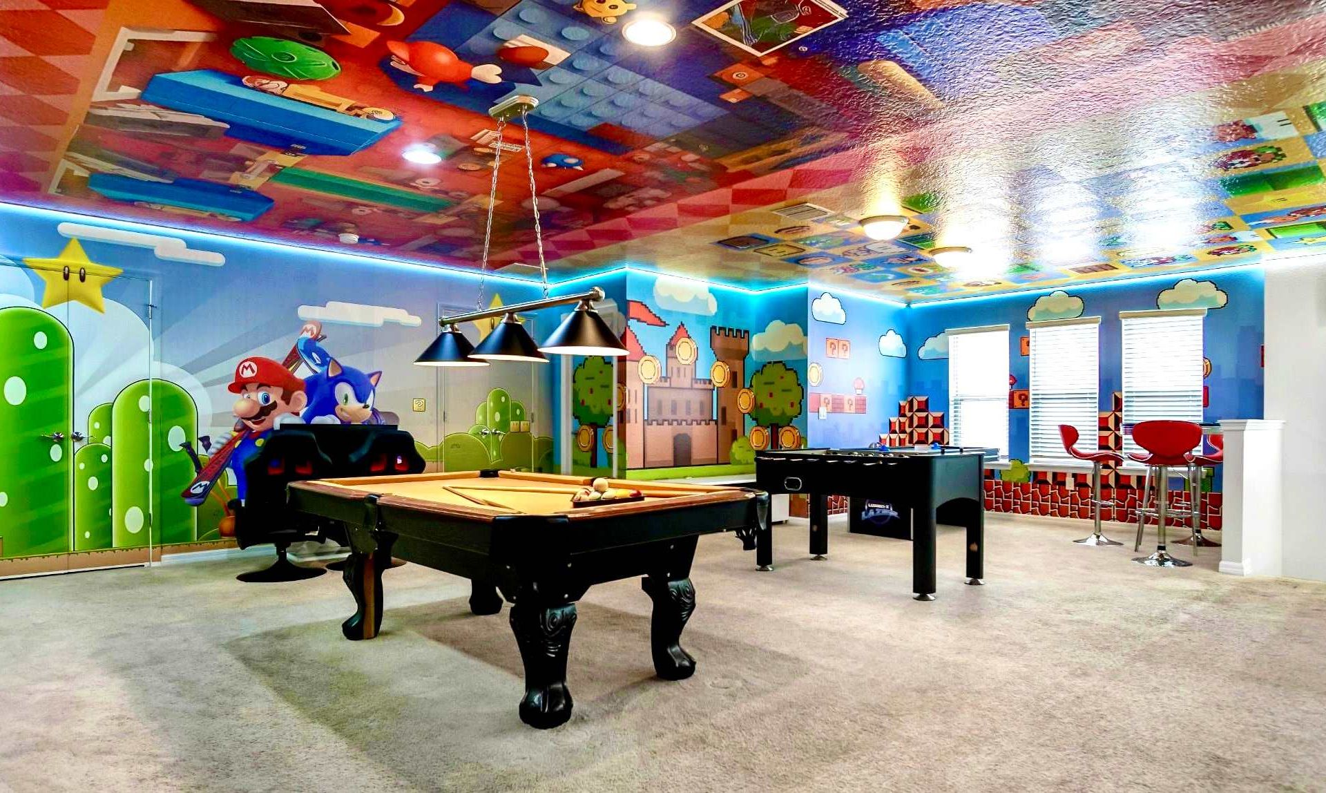 Epic themed game room with pool, foosball, and arcade-style fun for everyone.