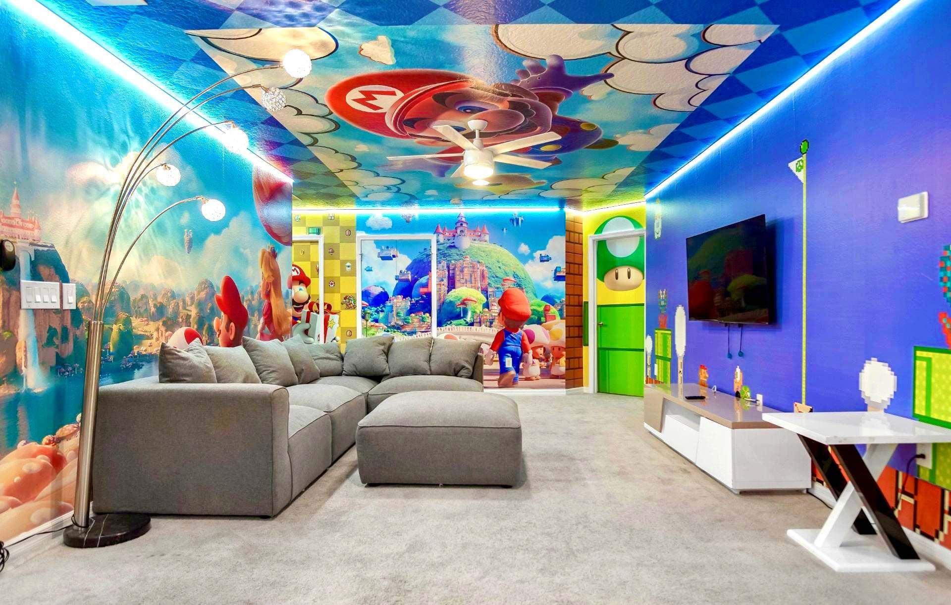 Colorful game lounge with themed walls, cozy seating, and fun for all ages.