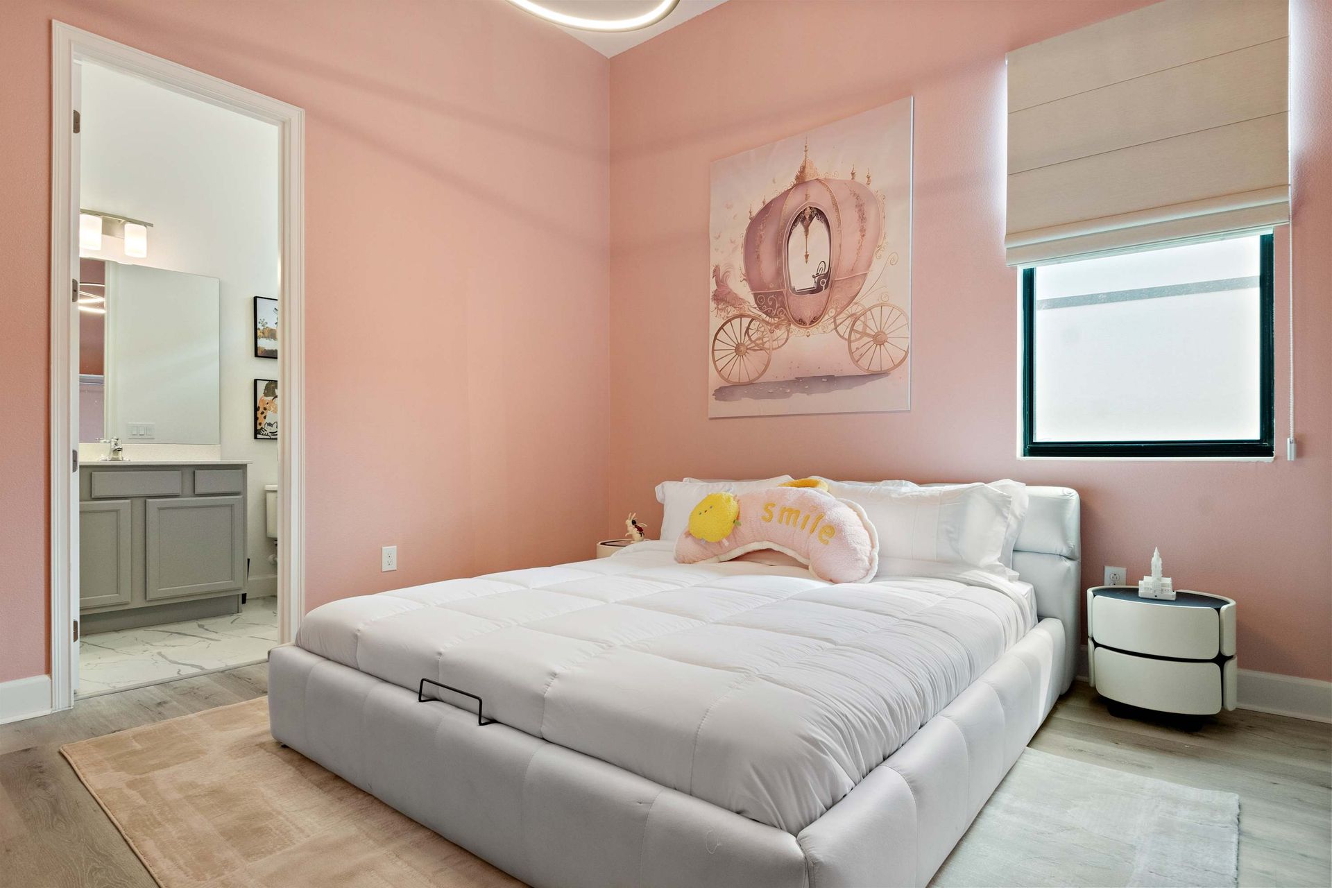 Princess-inspired pink bedroom with elegant décor, plush bed, and fairytale charm
