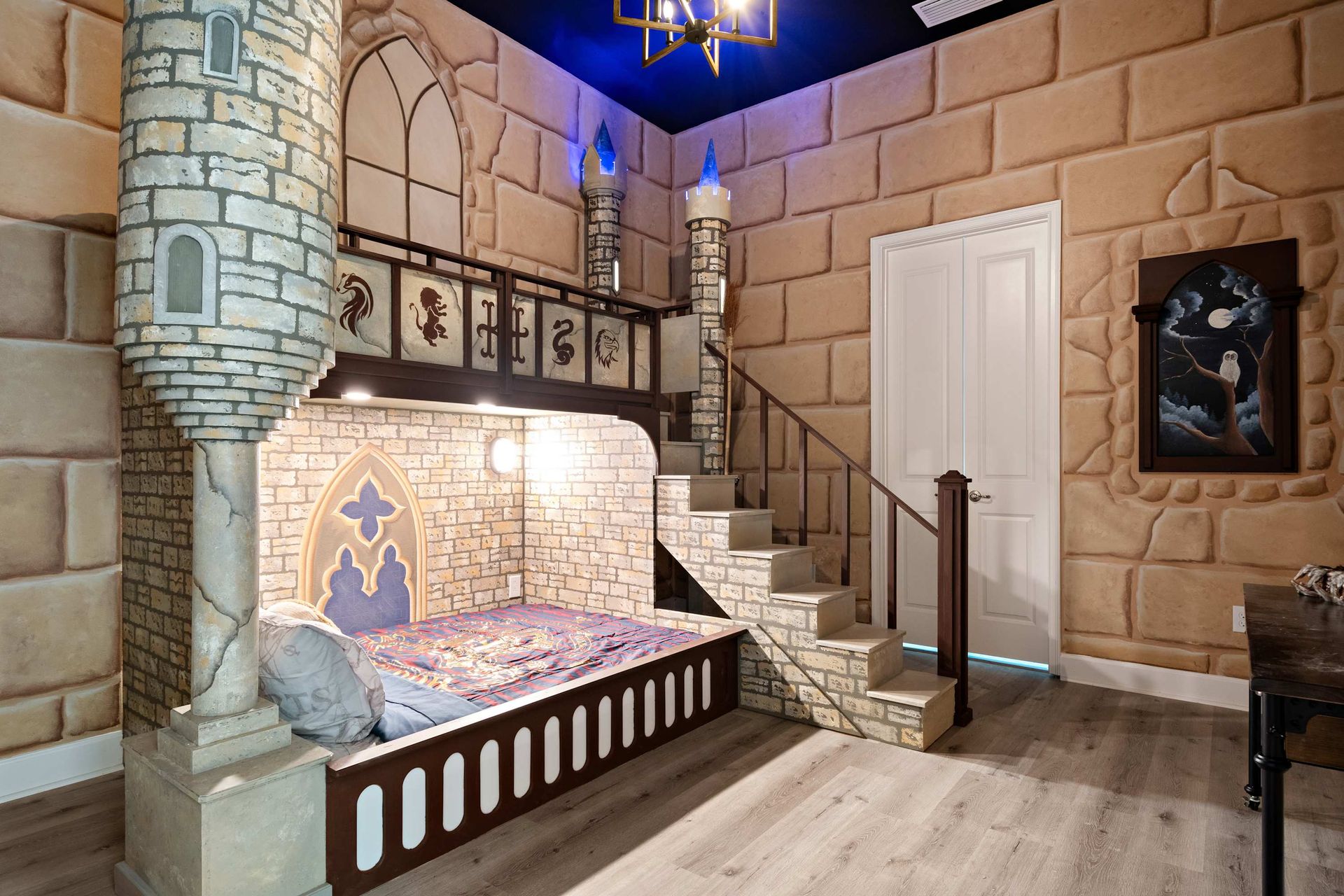 Whimsical castle-themed bedroom with lofted bunk, stone walls, and magical charm
