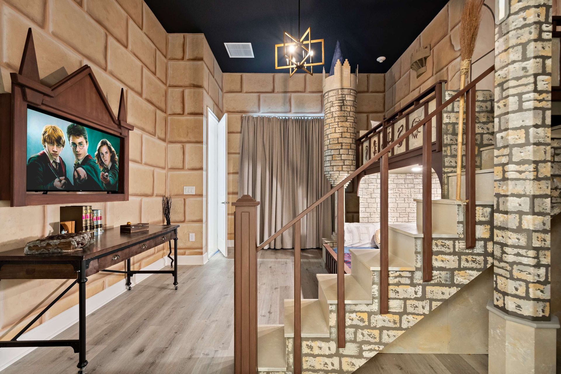 Whimsical castle-themed bedroom with lofted bunk, stone walls, and magical charm
