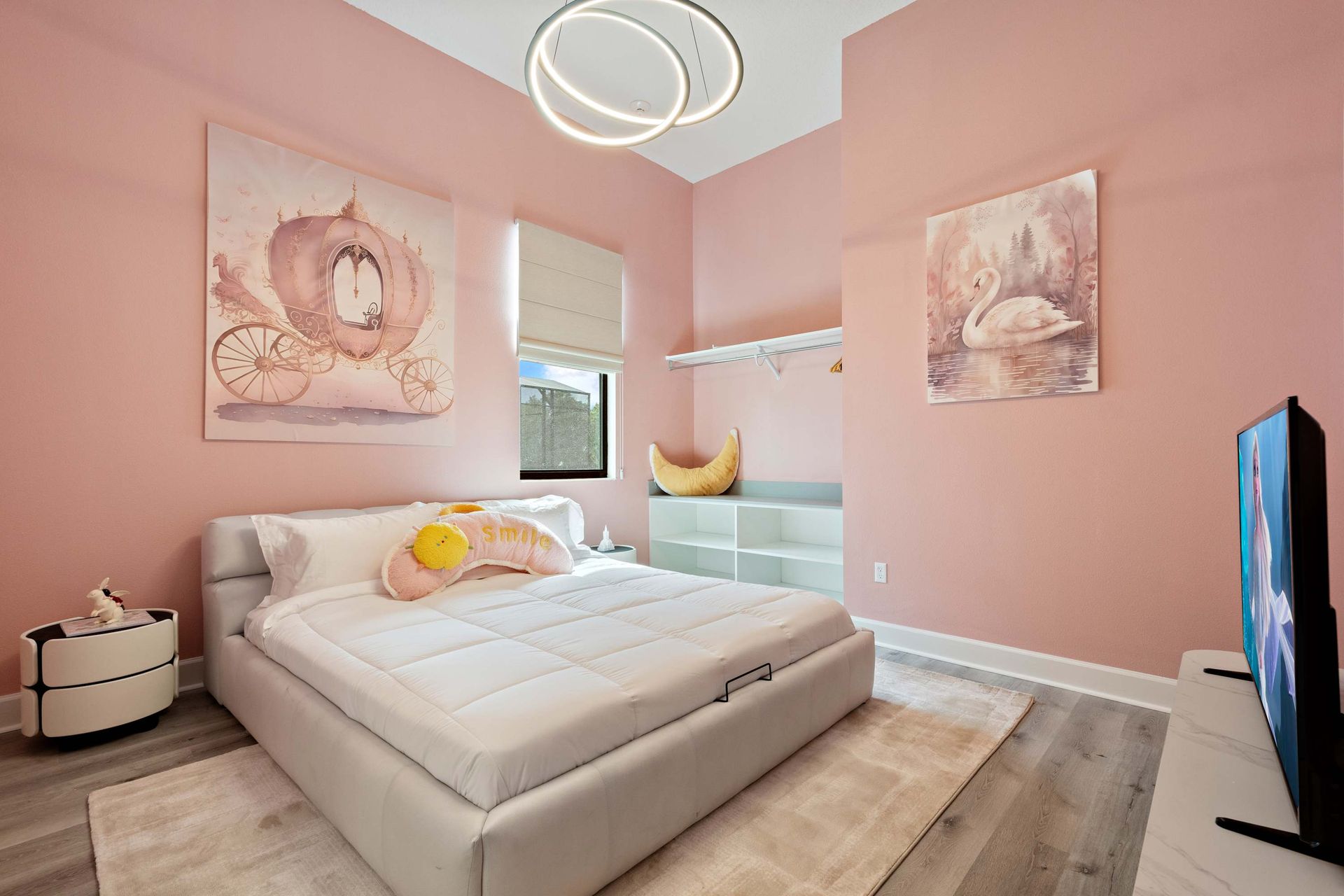 Princess-inspired pink bedroom with elegant décor, plush bed, and fairytale charm
