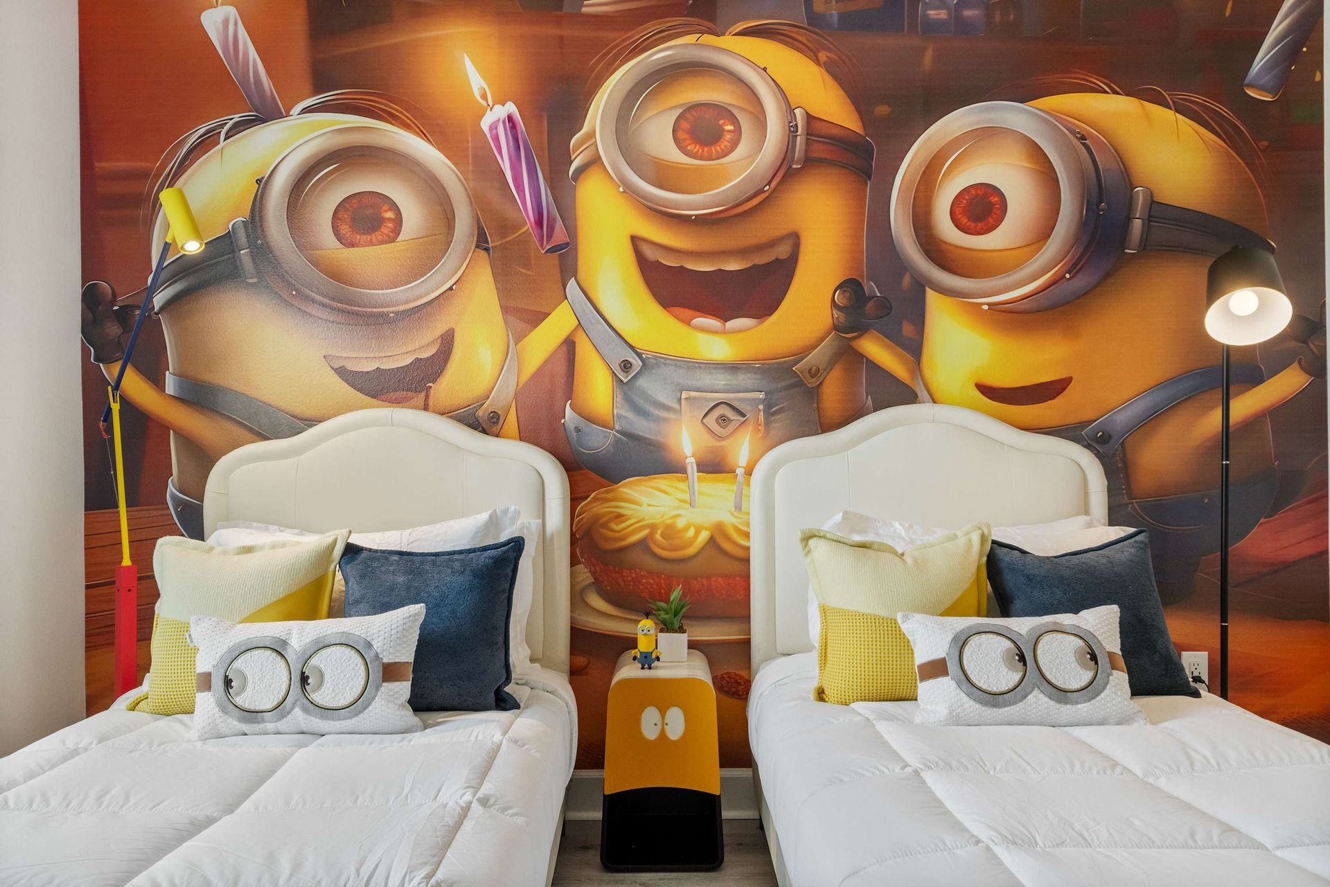 Playful Minion-themed bedroom with twin beds, bold colors, and joyful vibes
