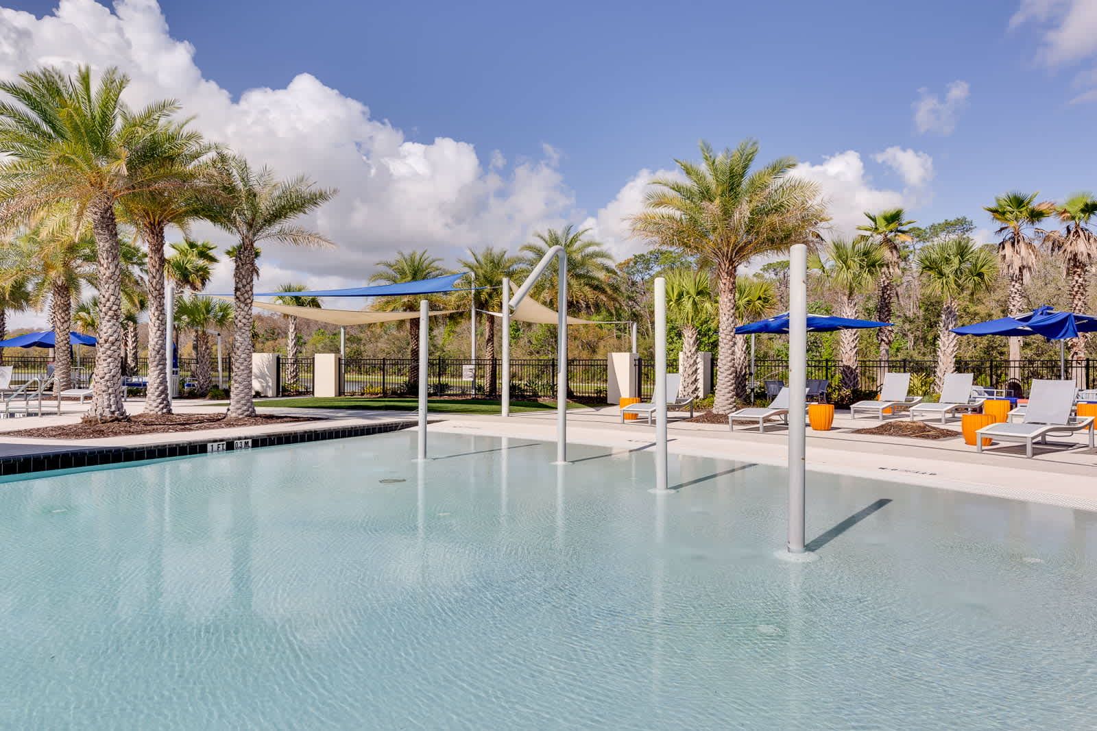 Relax poolside with chic loungers, palm-fringed comfort in sunlit tranquility.
