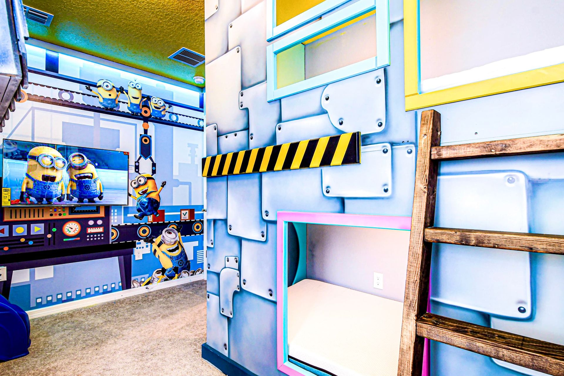 Minion-inspired bunk room with ladders, themed walls, and playful adventure vibes!
