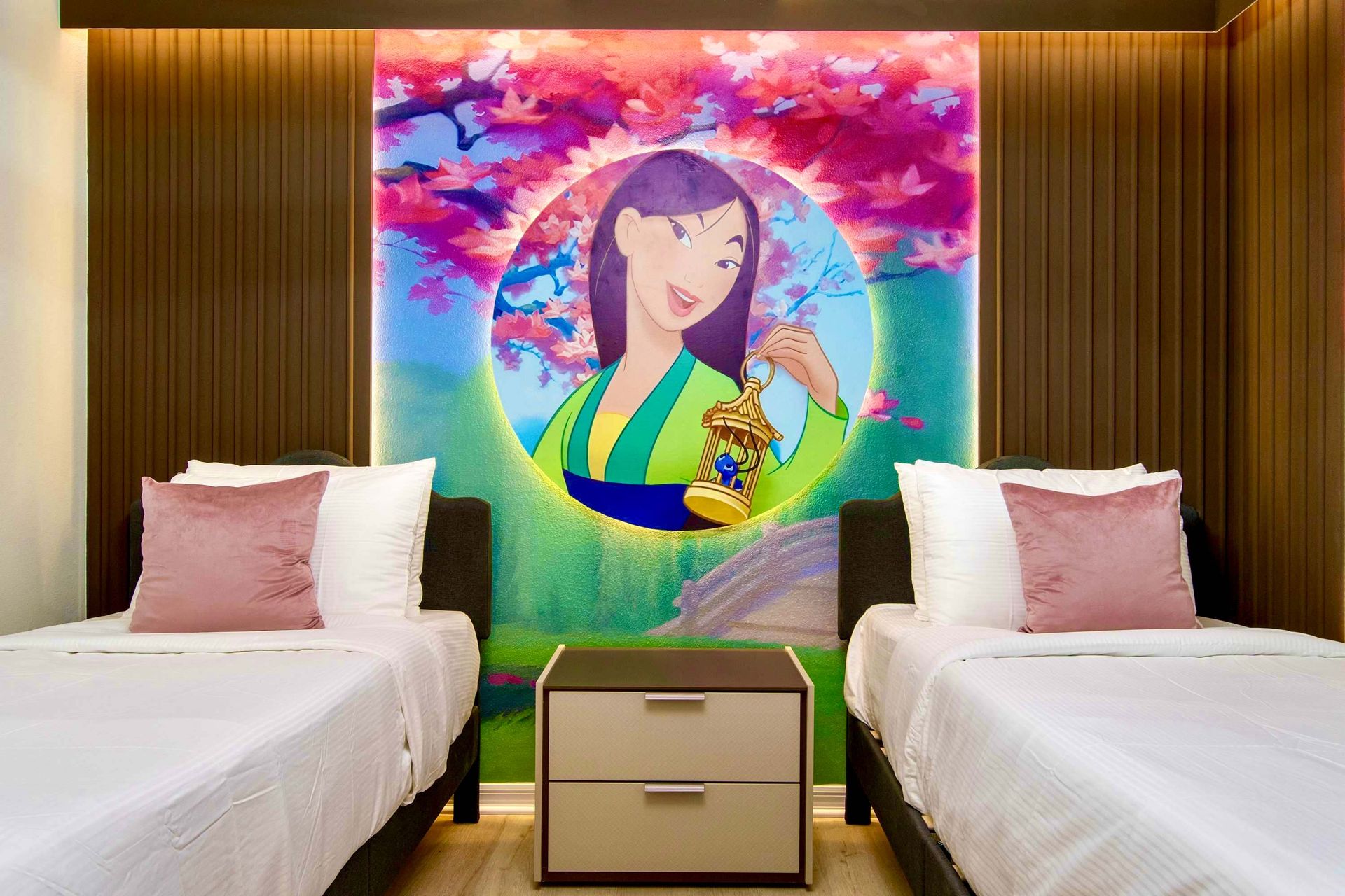 Serene princess-themed room with twin beds, cherry blossoms, and vibrant mural
