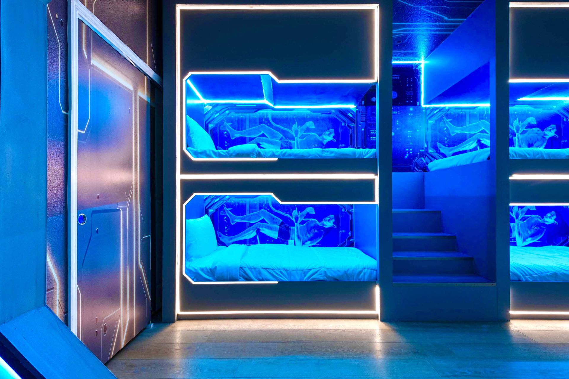 High-tech bunk room with neon lighting, sleek design, and a space-lab atmosphere
