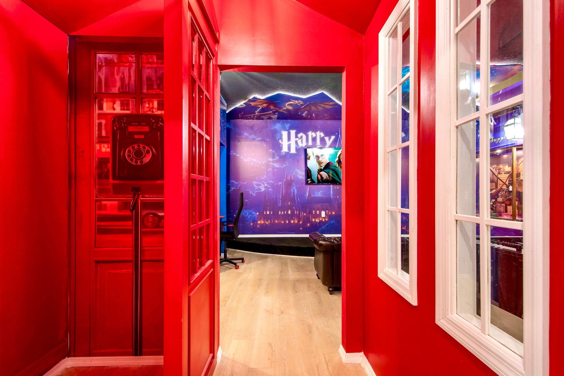 Step into a magical red phone booth entryway that leads to a wizard-themed adventure
