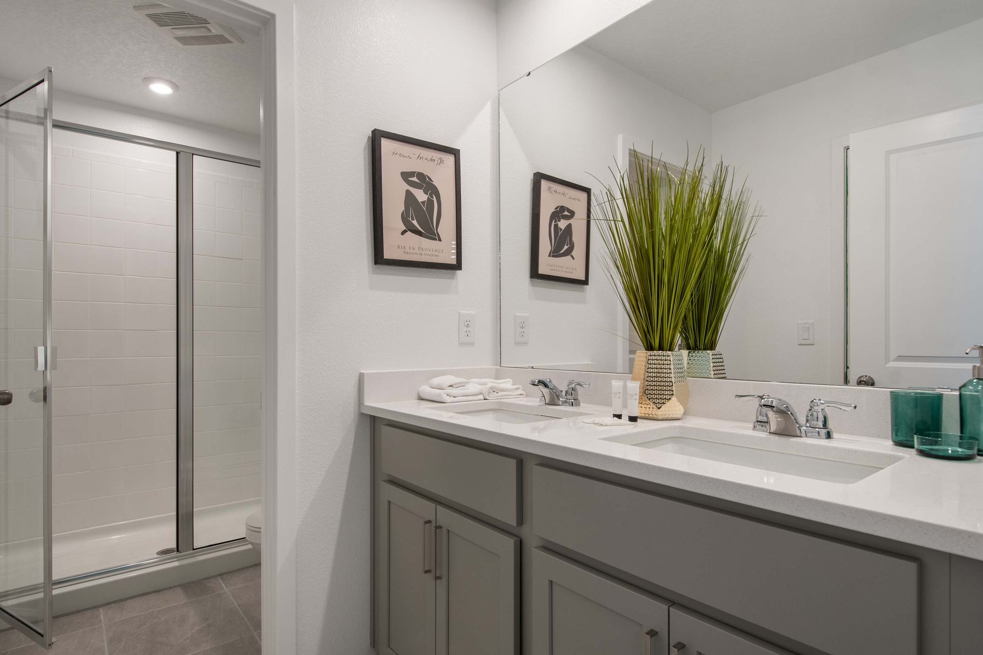 Stylish Bathroom with Glass Shower, Modern Vanity & Contemporary Decor
